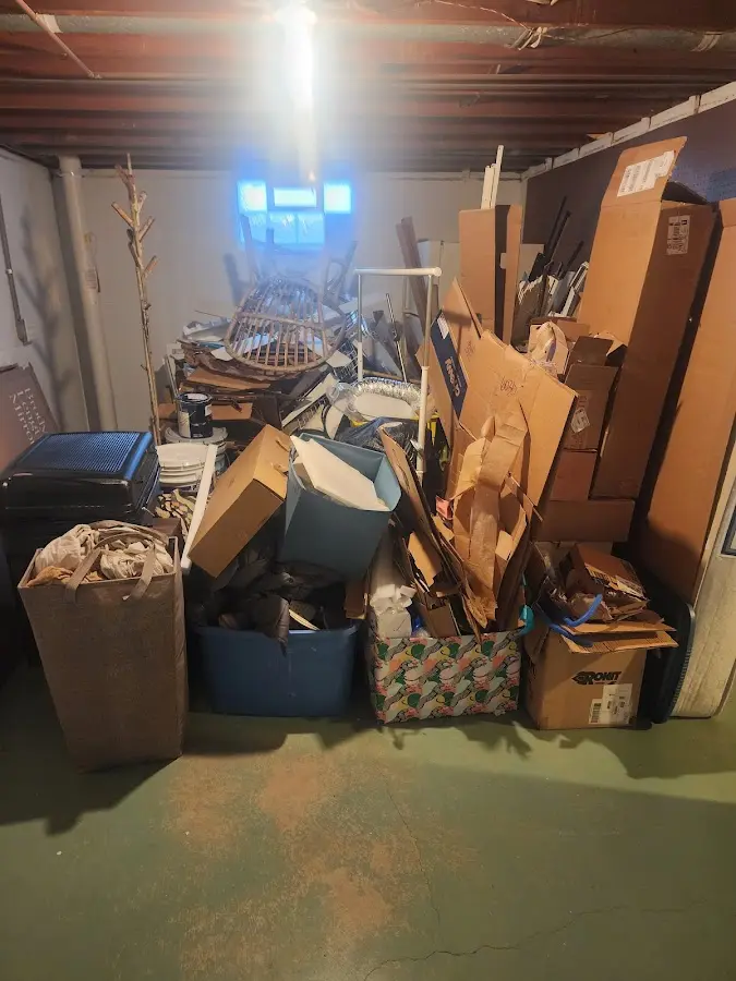 Roll-off dumpster container at job site for 2 Yard Dumpster Rental in Sidney